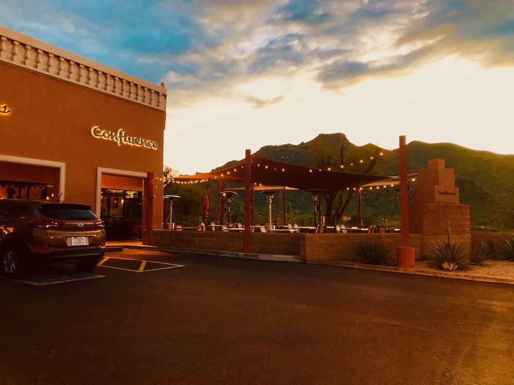 Confluence at sunset with the Carefree mountains behind the patio