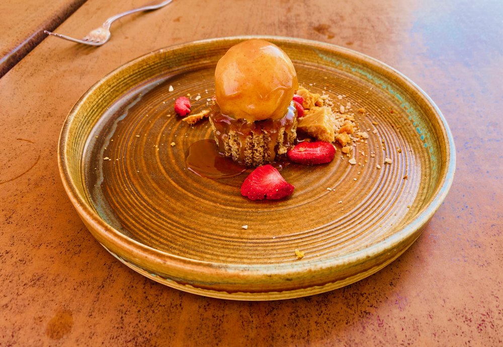 Caramel dessert with strawberries and crumble